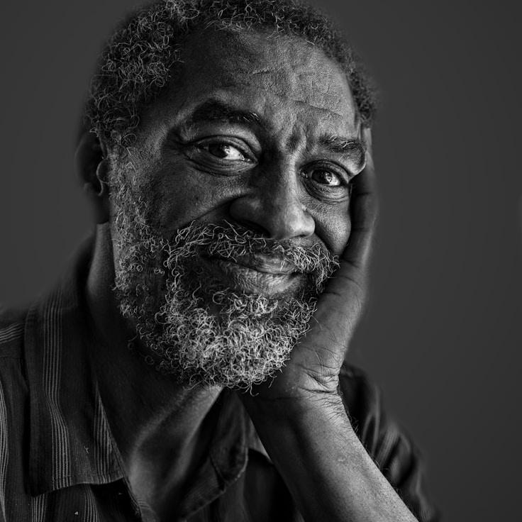 Kaveri Mehta, Lead Design Curator at Field Grove Harbor, reviewing corporate floral arrangements